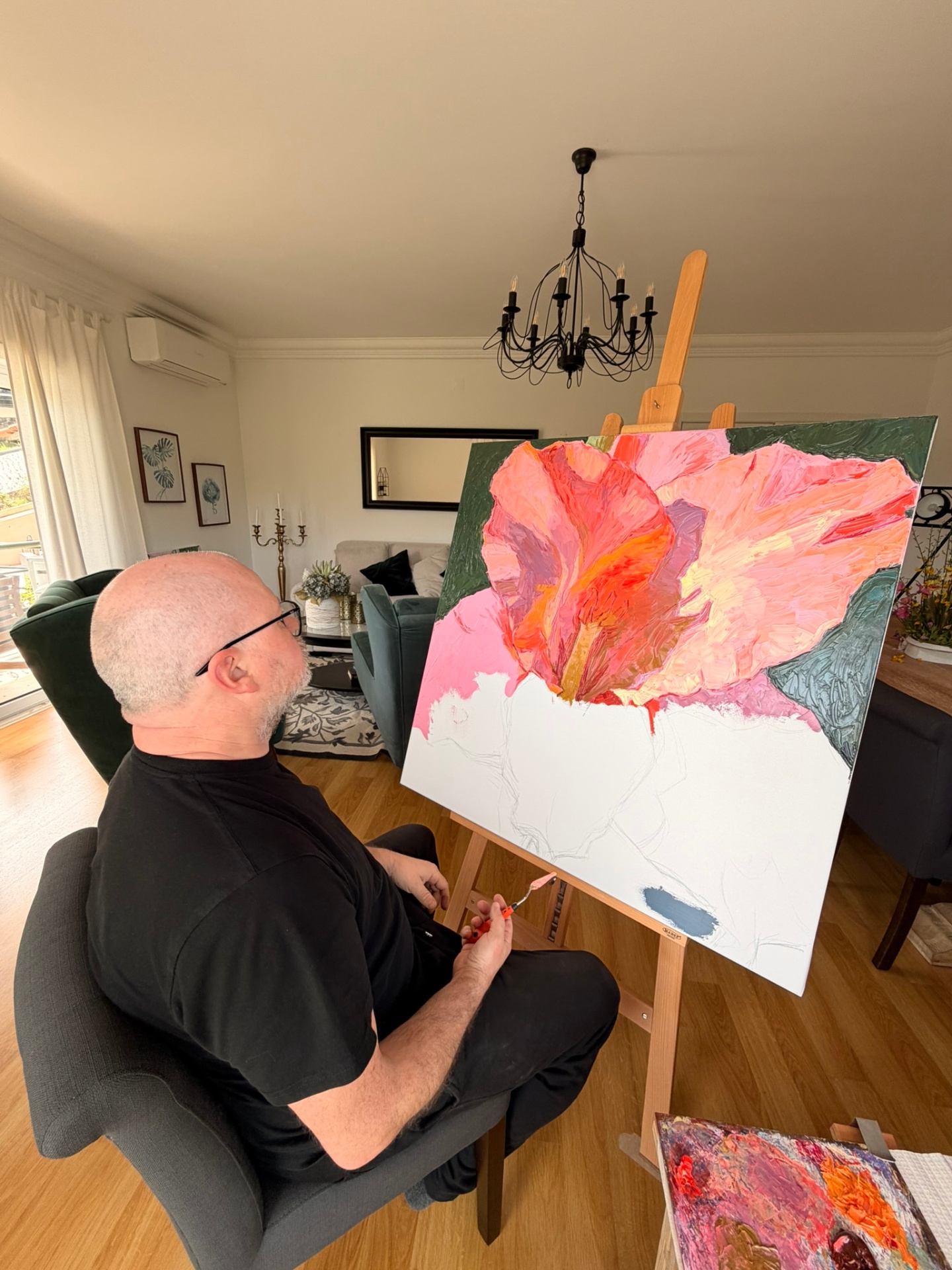 Evgeny Maximov working on the Gladiolus canvas in his studio