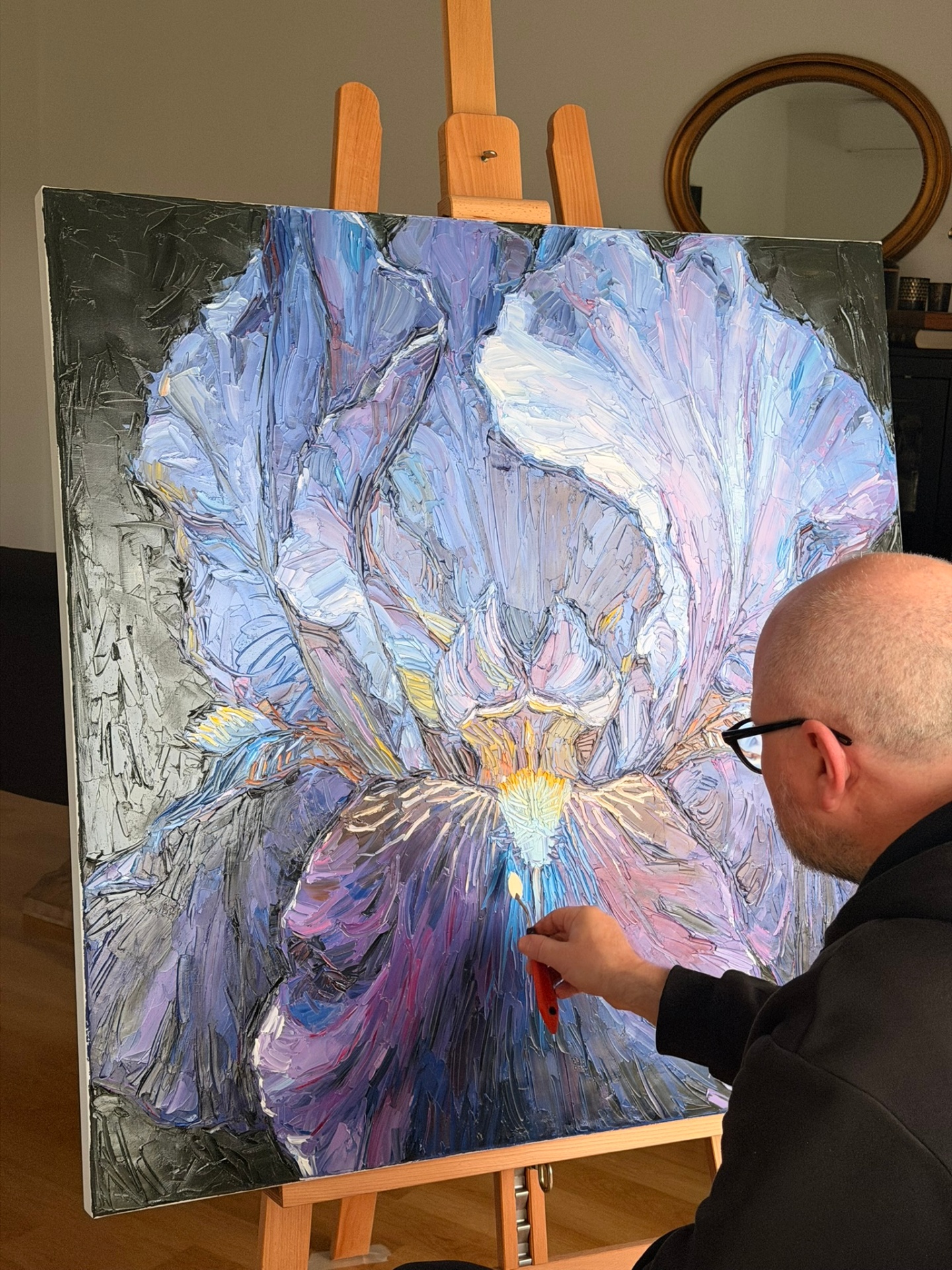 The finished Iris painting on the easel in the studio