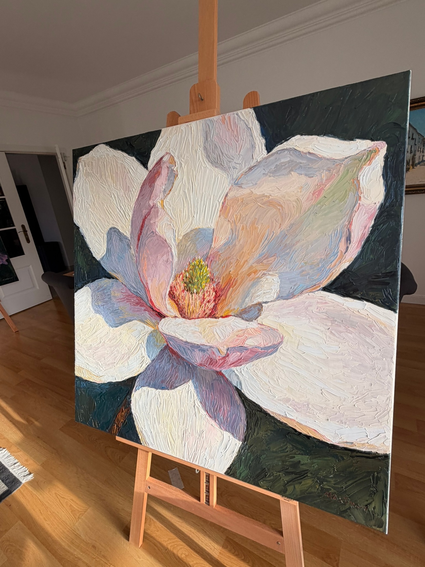 The finished Magnolia painting on the easel in the studio