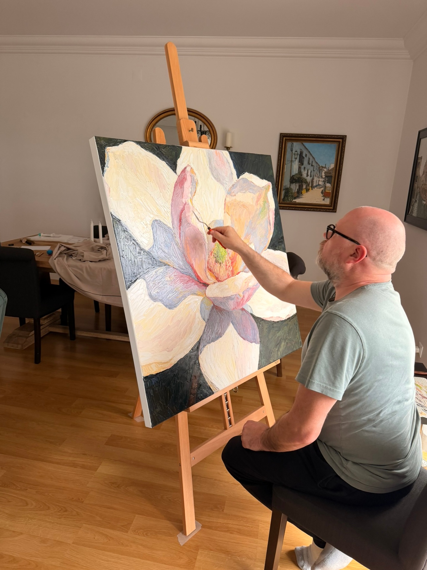 Evgeny Maximov working on the Magnolia canvas in his studio