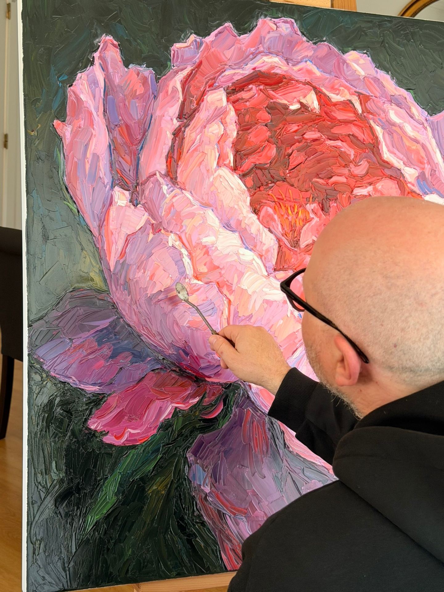 Evgeny Maximov working on the Peony canvas in his studio