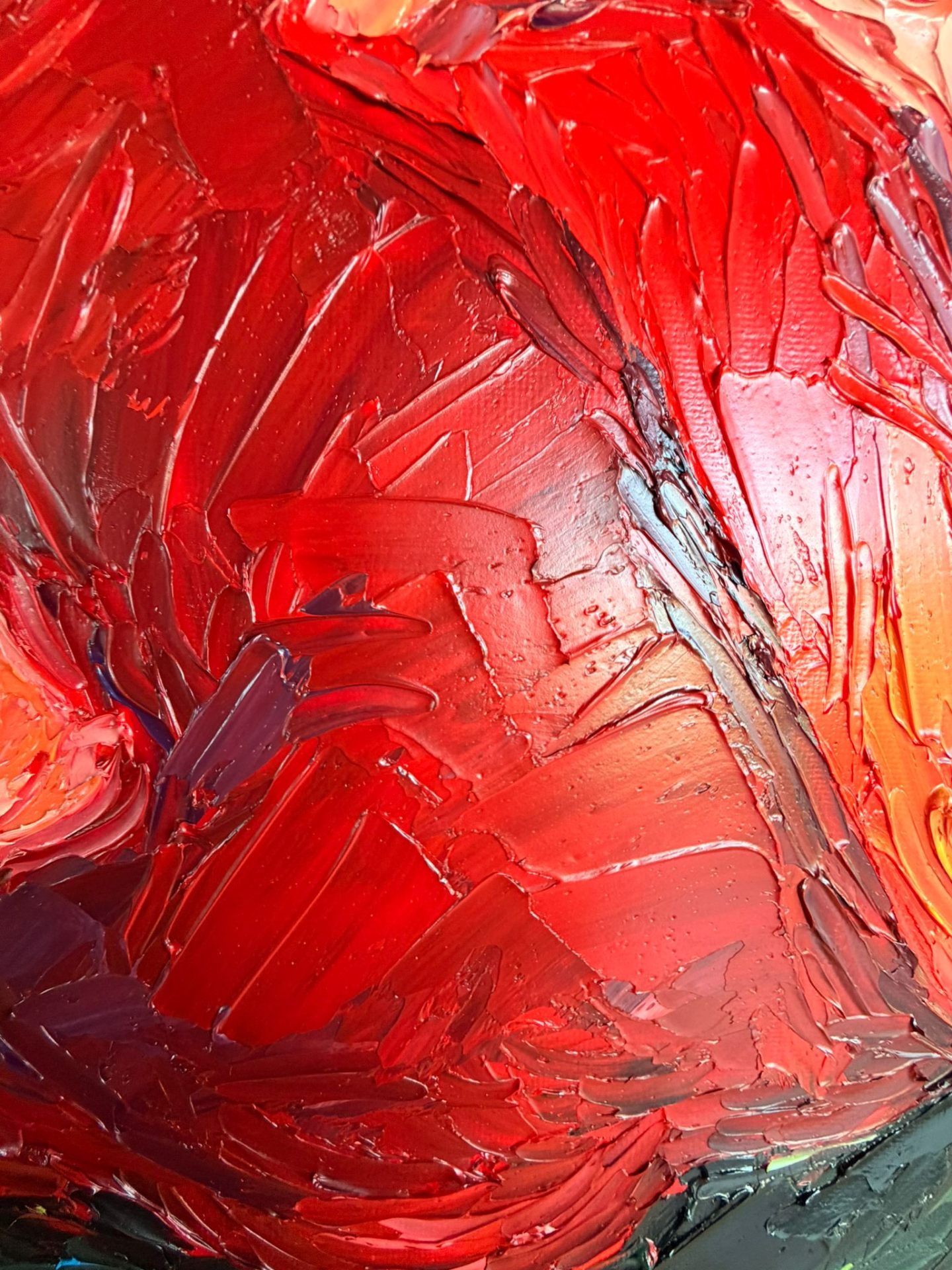 Macro detail of layered crimson impasto petals in the Poppy