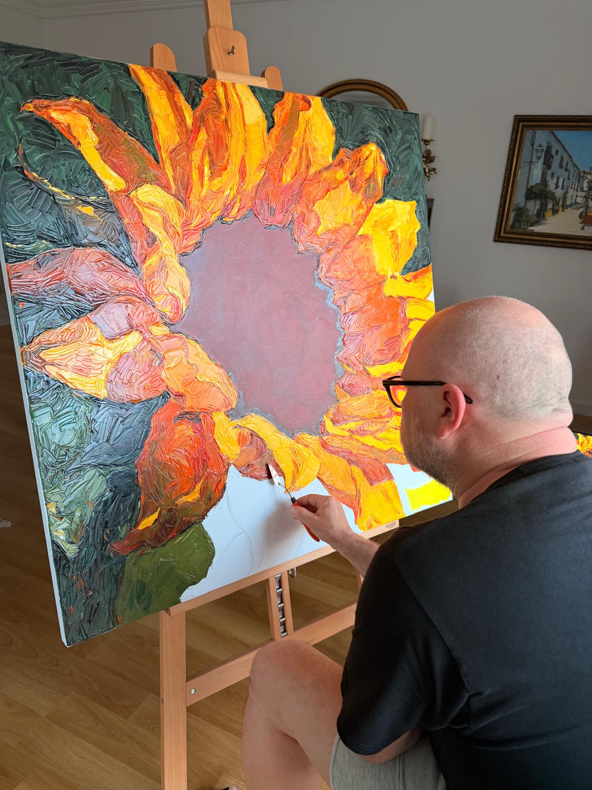 Evgeny Maximov working the petals of the Sunflower with a palette knife