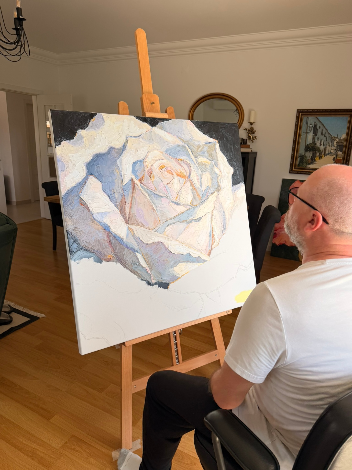 Evgeny Maximov working on the White Rose canvas in his studio